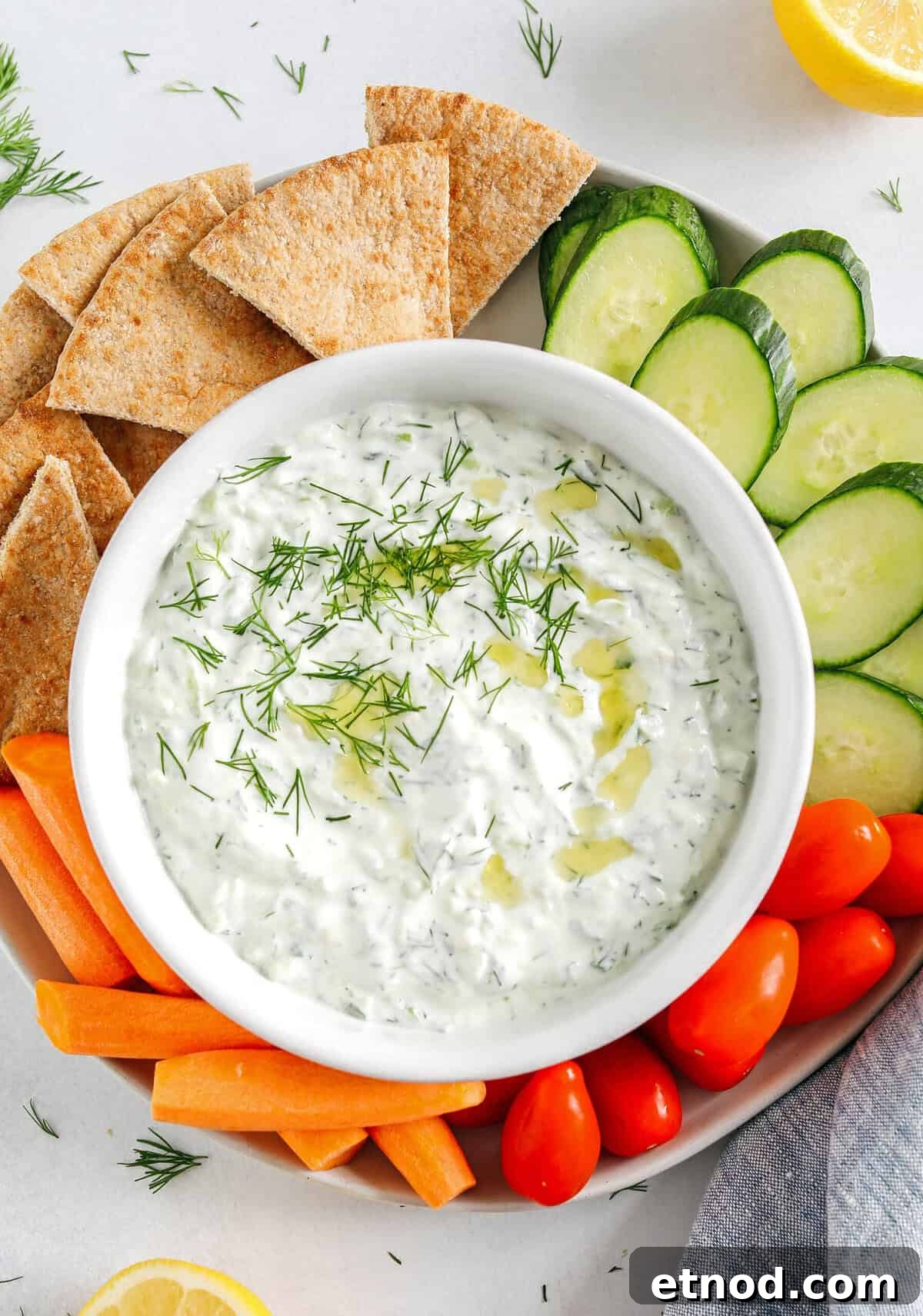 Authentic Homemade Tzatziki Recipe for Creamy Greek Sauce 5 Fresh and flavorful Homemade Tzatziki Sauce is a creamy yogurt-based sauce perfect for the summer served with kabobs, grilled veggies, pita bread and more! This recipe is easily made in just 5 minutes with a few simple ingredients!