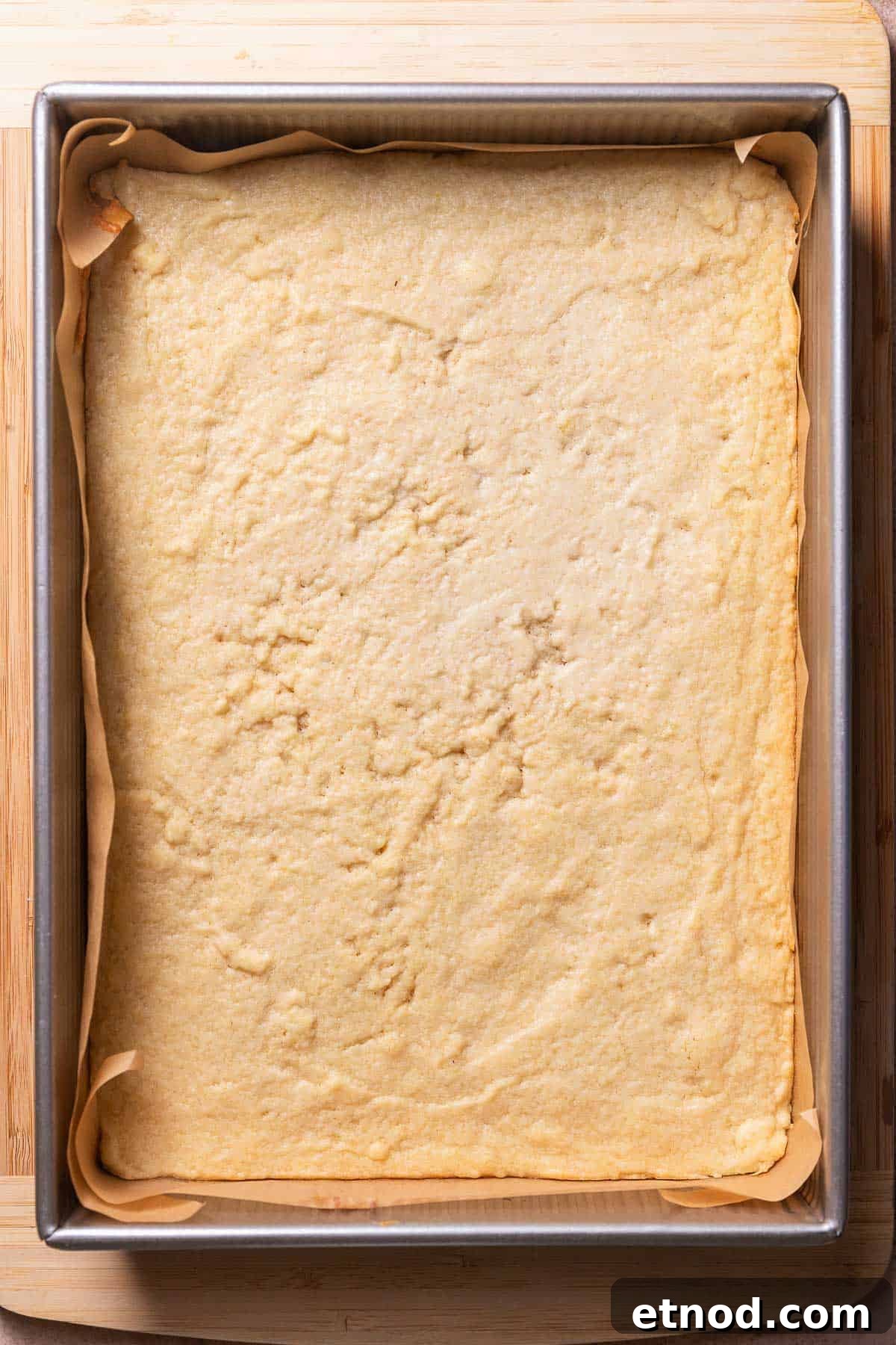 Chewy Christmas Sugar Cookie Bars with Festive Sprinkles 6 The baked sugar cookie bars in a baking pan.