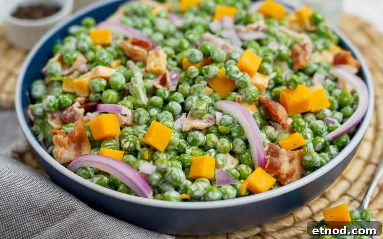 31 Forgotten Grandma Potluck Recipes Worth Bringing Back 19 Pea salad in a blue bowl.