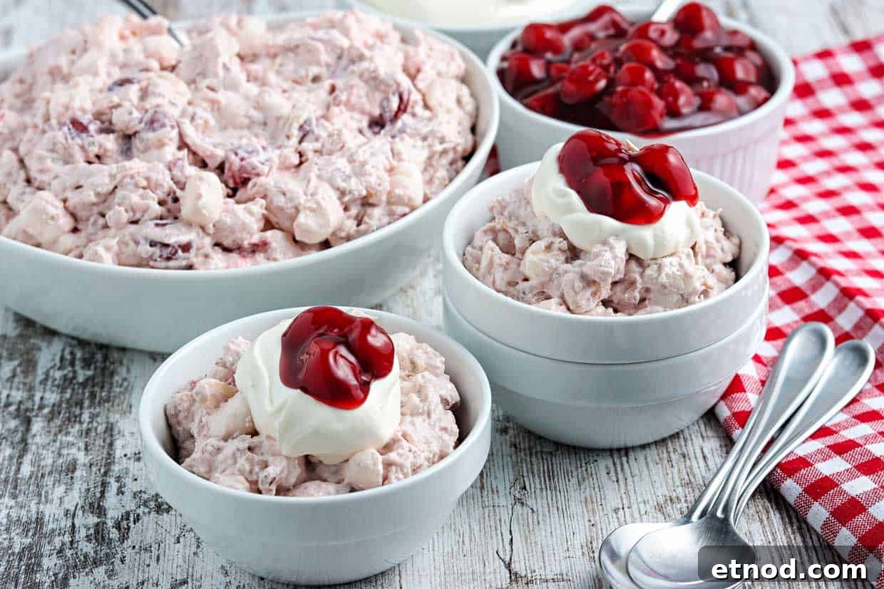 31 Forgotten Grandma Potluck Recipes Worth Bringing Back 6 Cherry fluff salad in blue bowls with whipped cream.