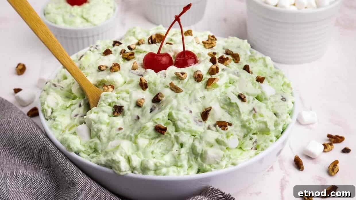 31 Forgotten Grandma Potluck Recipes Worth Bringing Back 9 Pistachio salad topped with nuts and cherries.