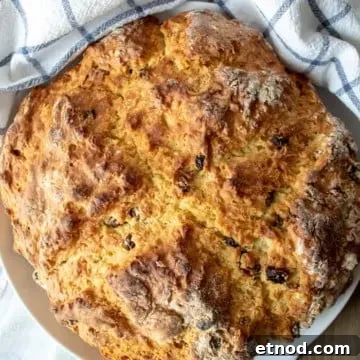 Classic Irish Soda Bread Recipe: Simple Traditional Loaf 2 Irish Soda Bread, round loaf on serving plate.