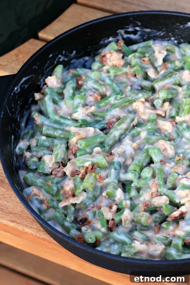 Smoky Grilled Green Bean Casserole with Crispy Bacon 6 casserole in cast iron skillet prior to cooking