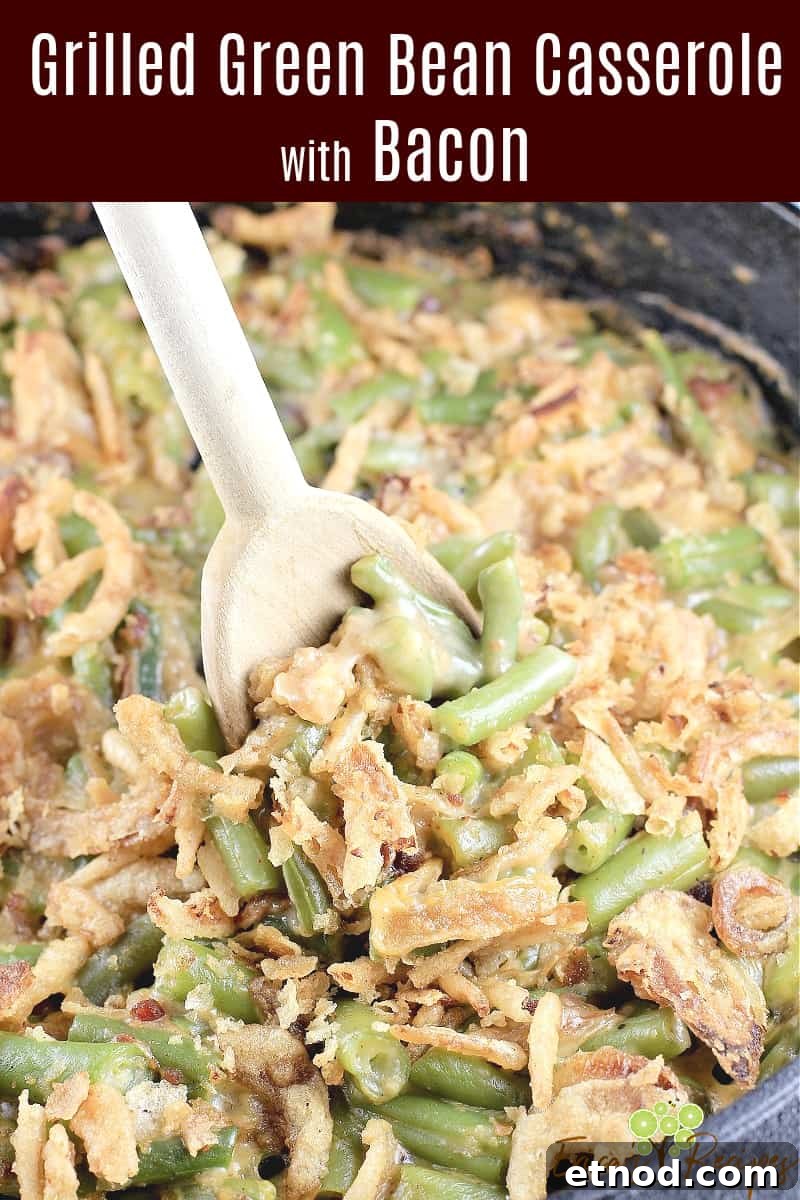Smoky Grilled Green Bean Casserole with Crispy Bacon 10 image for sharing on social media with spoon lifting casserole; text overly of recipe title