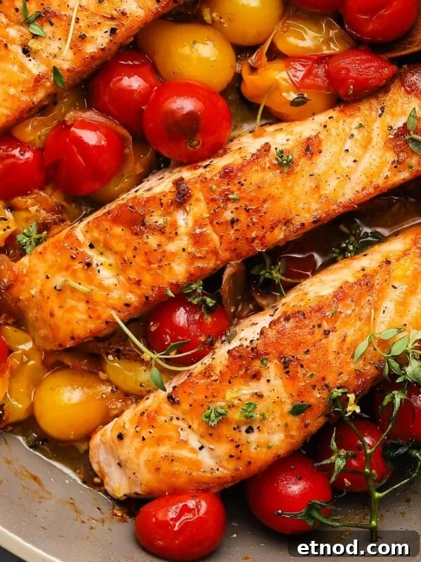 Old Bay Shrimp Cocktail with Creamy Mayo Dip 9 Seared salmon fillets with burst cherry tomatoes and fresh herbs in a skillet.