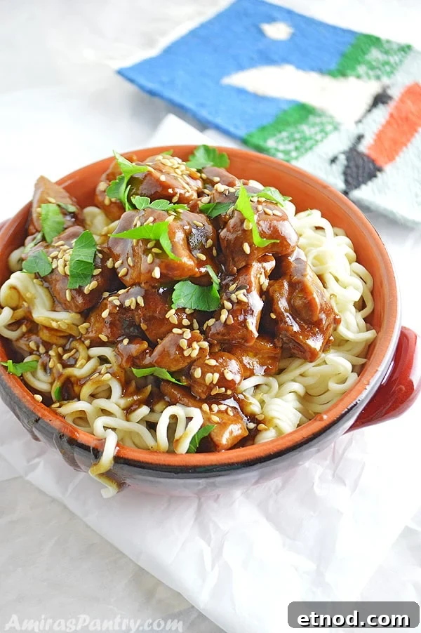 A close up of a plate of food, with Tamarind Chicken and pasta