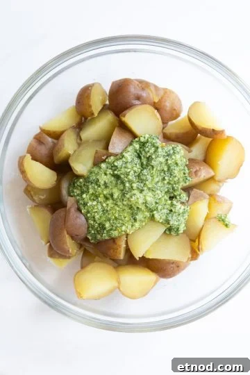 pesto added to red potatoes