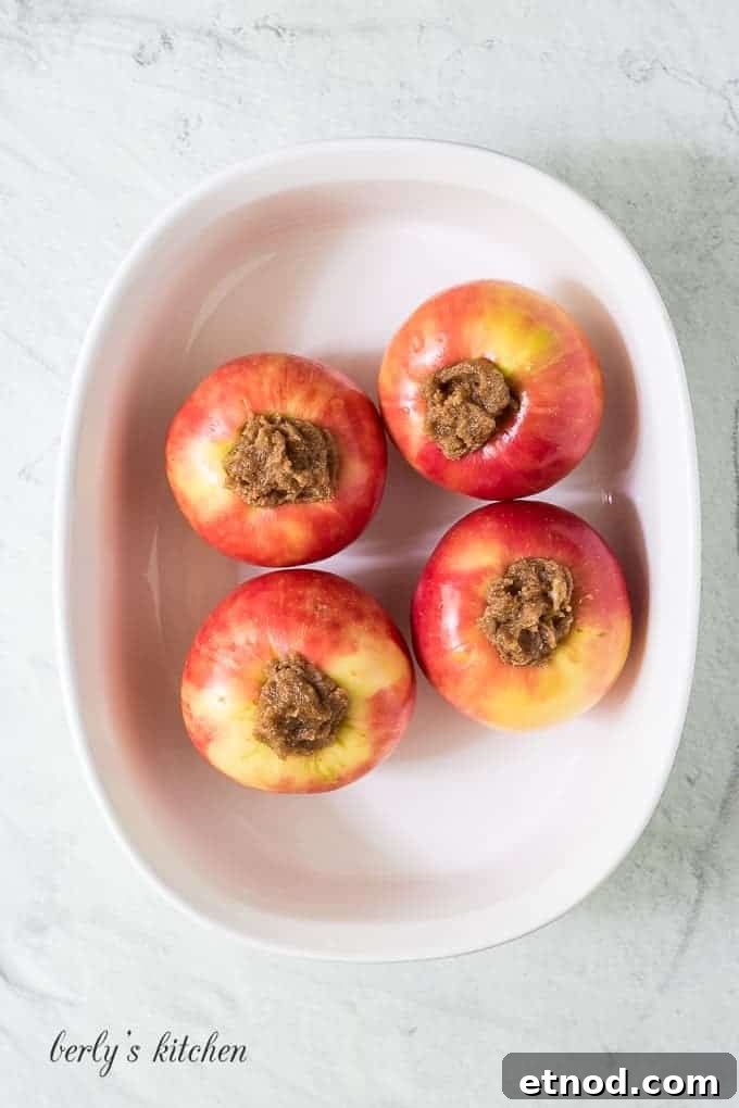 Warm Cinnamon Baked Apples with Caramel Drizzle 5 The four apples have been stuffed with the butter mixture.