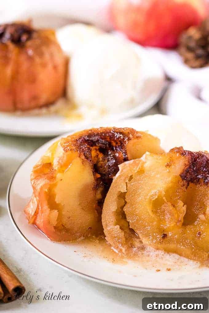 Warm Cinnamon Baked Apples with Caramel Drizzle 8 The baked apple has been cut in half to show the center.