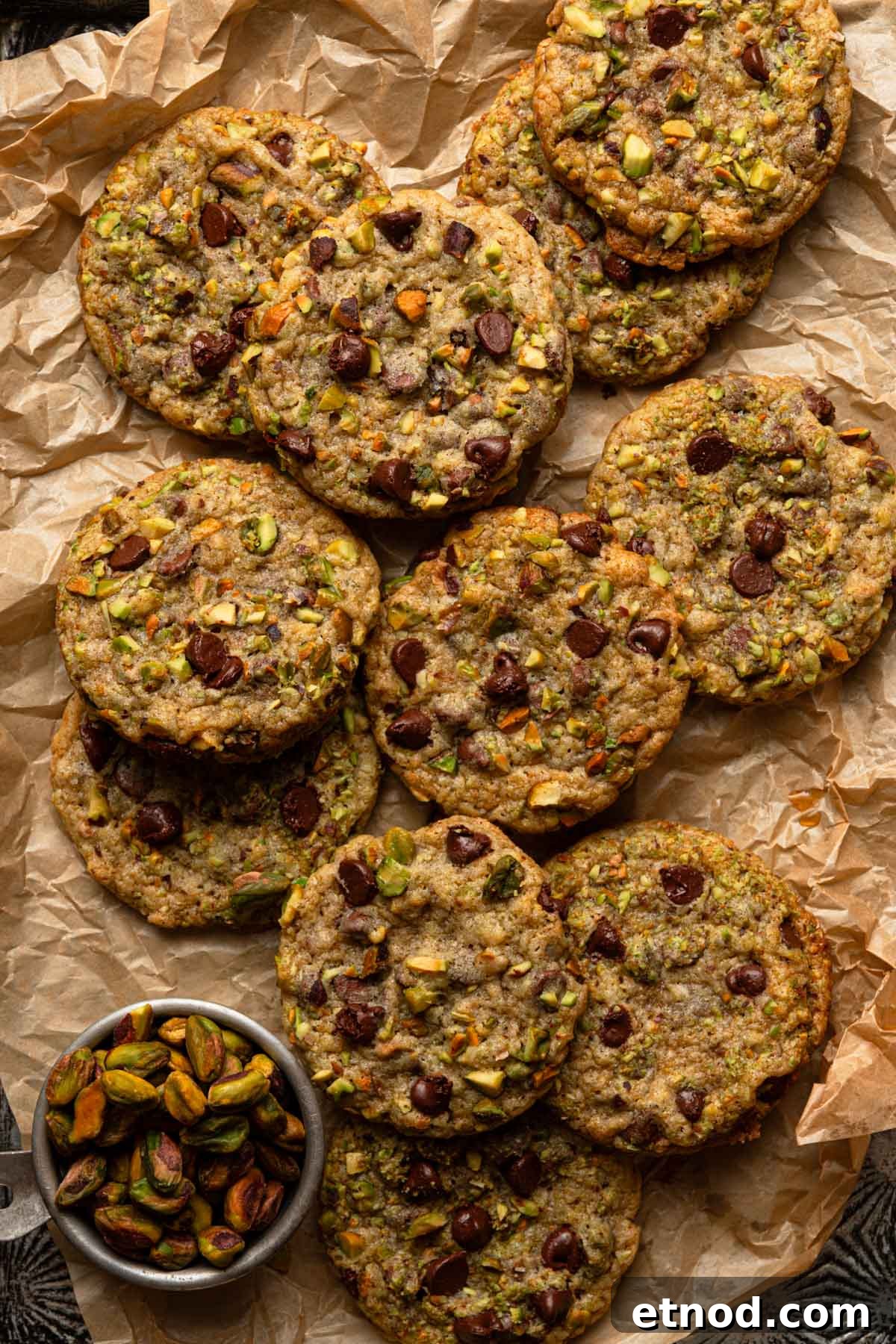 Pistachio cookies on a piece of parchment paper.