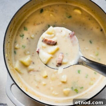 creamy potato soup in a large white pot