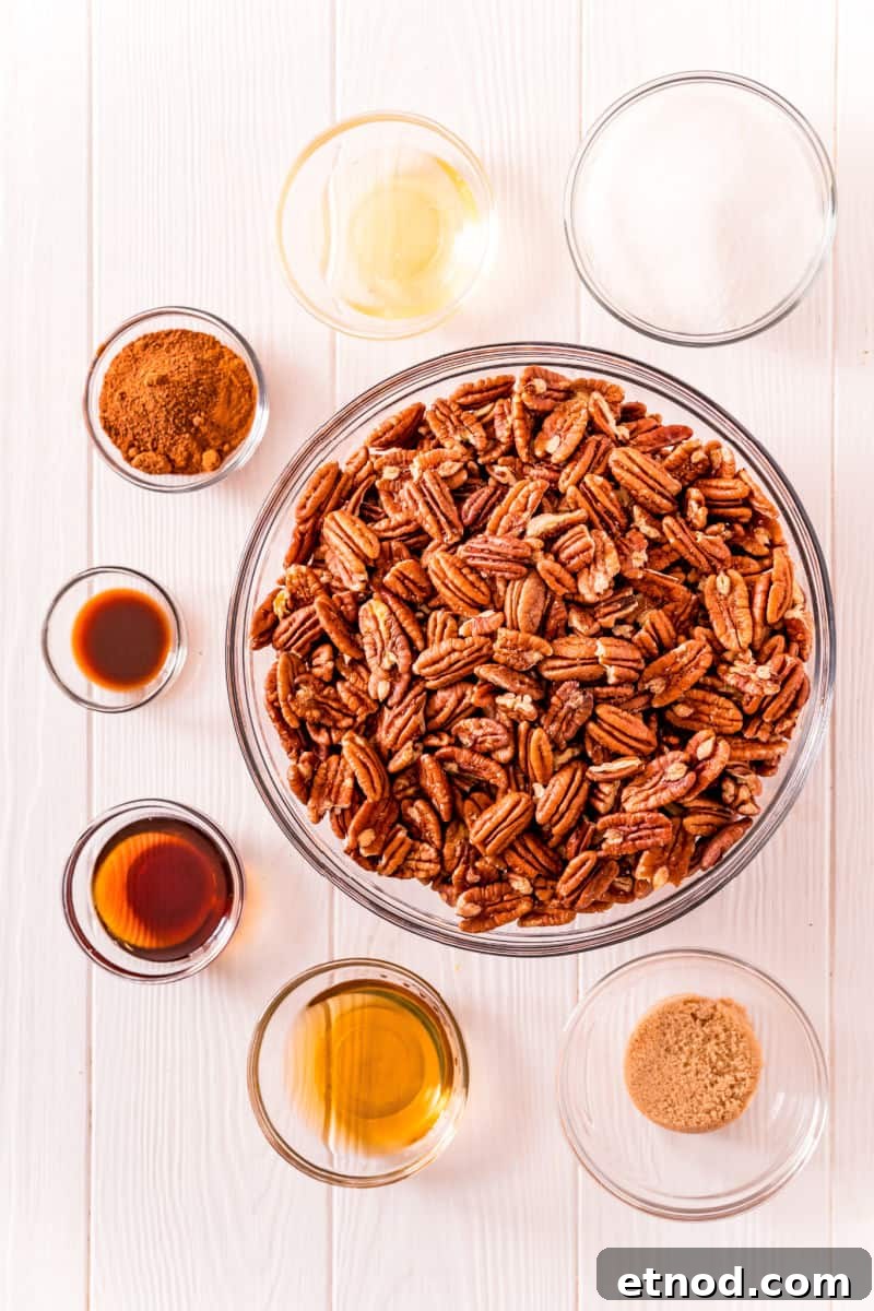 Candied Pecans made in a crockpot are an addictive party treat! With a delicious maple bourbon coating, they’re a great edible gift too! ingredients to make crockpot maple bourbon candied pecans in bowls on a table