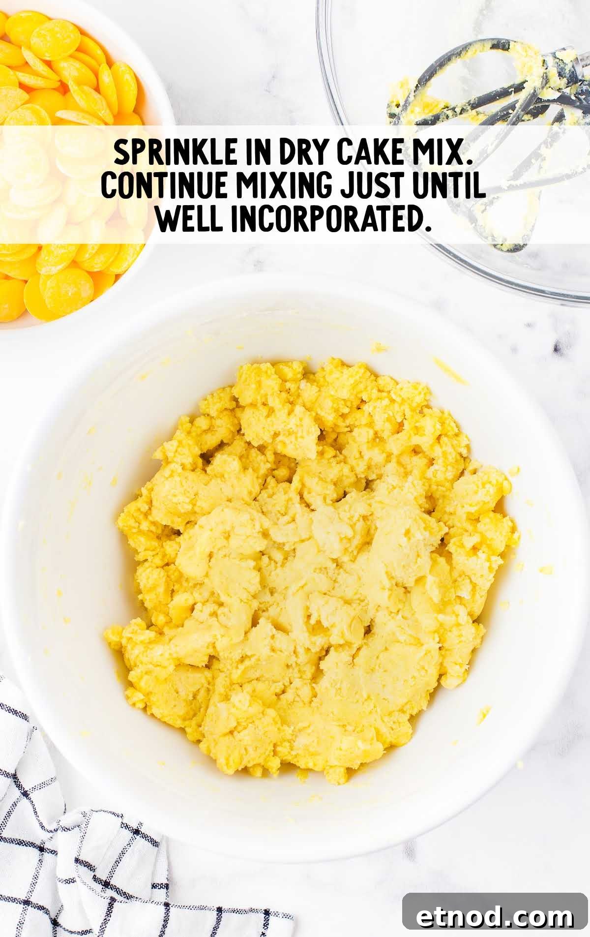 Mini Lemon Cheesecake Bites: Creamy No-Bake Dessert Recipe 4 dry cake mix added to the cream cheese mixture in a bowl