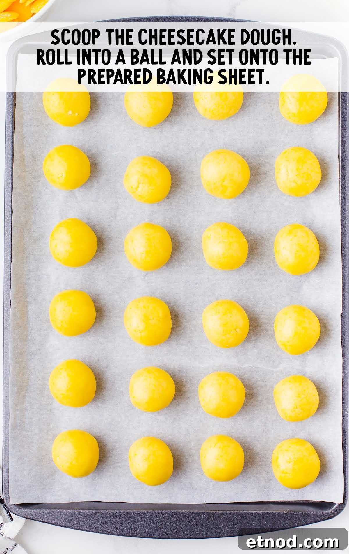 Mini Lemon Cheesecake Bites: Creamy No-Bake Dessert Recipe 5 cheesecake dough rolled into a ball and placed on the baking sheet
