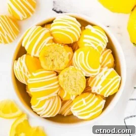 Mini Lemon Cheesecake Bites: Creamy No-Bake Dessert Recipe 10 overhead shot of Lemon Cheesecake Bites in a bowl with one split in half