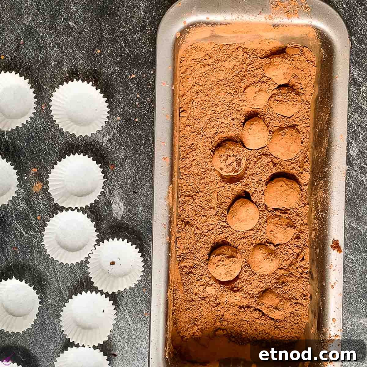 Biscoff Truffles Made Without Cream Cheese — Simple No-Bake Recipe 3 Rolling the Biscoff truffles in cacao powder and placing them into chocolate paper cups.