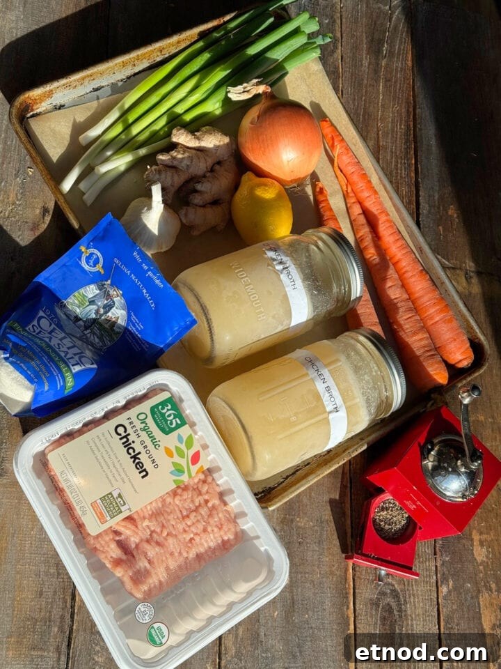 Healing Ginger Chicken Soup Recipe for Cold Relief 3 ingredients for chicken meatballs on a sheet tray