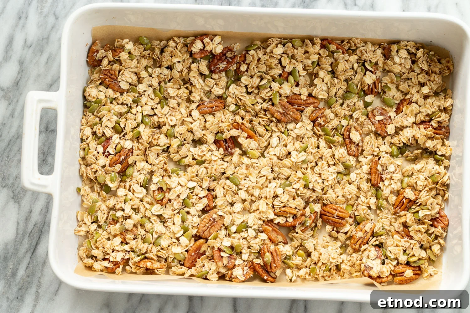 Cardamom Maple Pecan Granola — Oil-Free Homemade Recipe 7 Our Vegan Maple Pecan Granola in a white baking dish