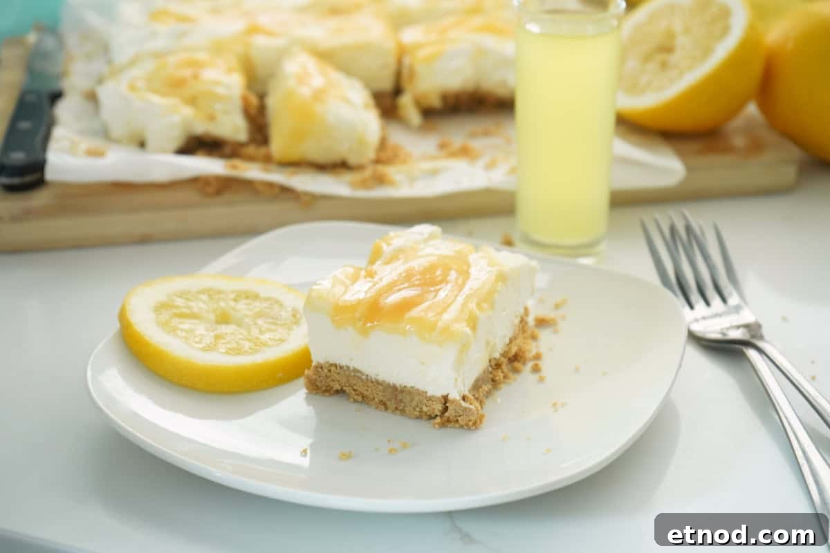 Limoncello Cheesecake Bars (No-Bake) 2 Limoncello Cheesecake Bars with fork