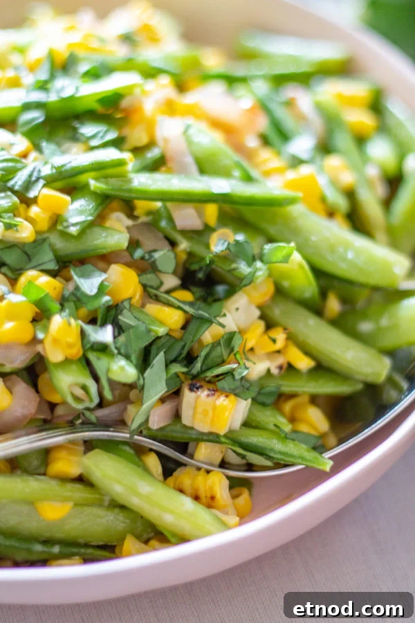 Sugar Snap Pea and Corn Salad | This Sugar Snap Pea and Corn Salad with caramelized shallots and a citrus yogurt dressing is an untraditional addition to Thanksgiving dinner that my family loves. Sugar Snap Pea and Corn Salad | This Sugar Snap Pea and Corn Salad with caramelized shallots and a citrus yogurt dressing is an untraditional addition to Thanksgiving dinner that my family loves.