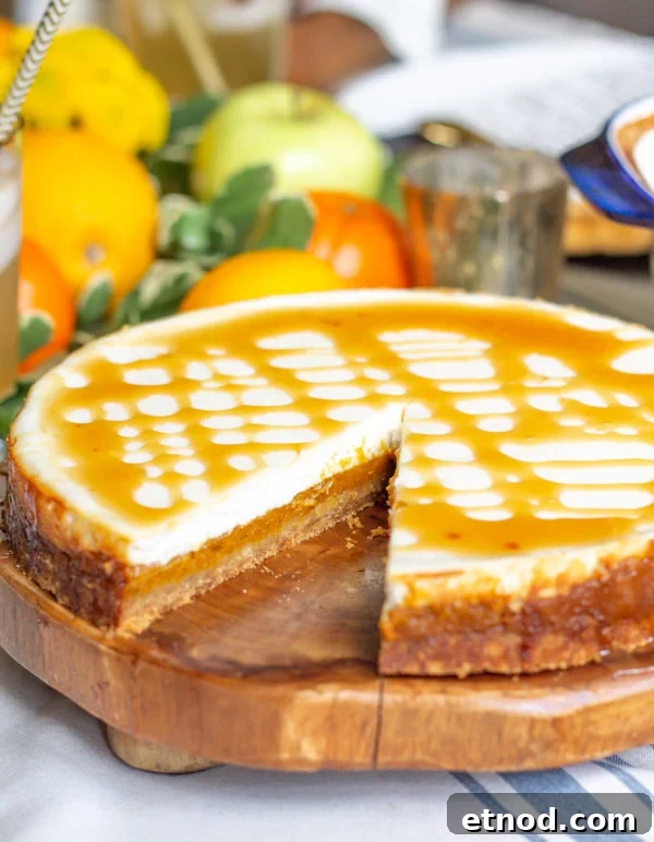 Reduced Fat Pumpkin Cheesecake | This cheesecake is has a layers of pumpkin filling and a fresh creamy yogurt cheesecake. It's a lighter healthier dessert to serve your family this #Thanksgiving. Reduced Fat Pumpkin Cheesecake | This cheesecake is has a layers of pumpkin filling and a fresh creamy yogurt cheesecake. It's a lighter healthier dessert to serve your family this #Thanksgiving.