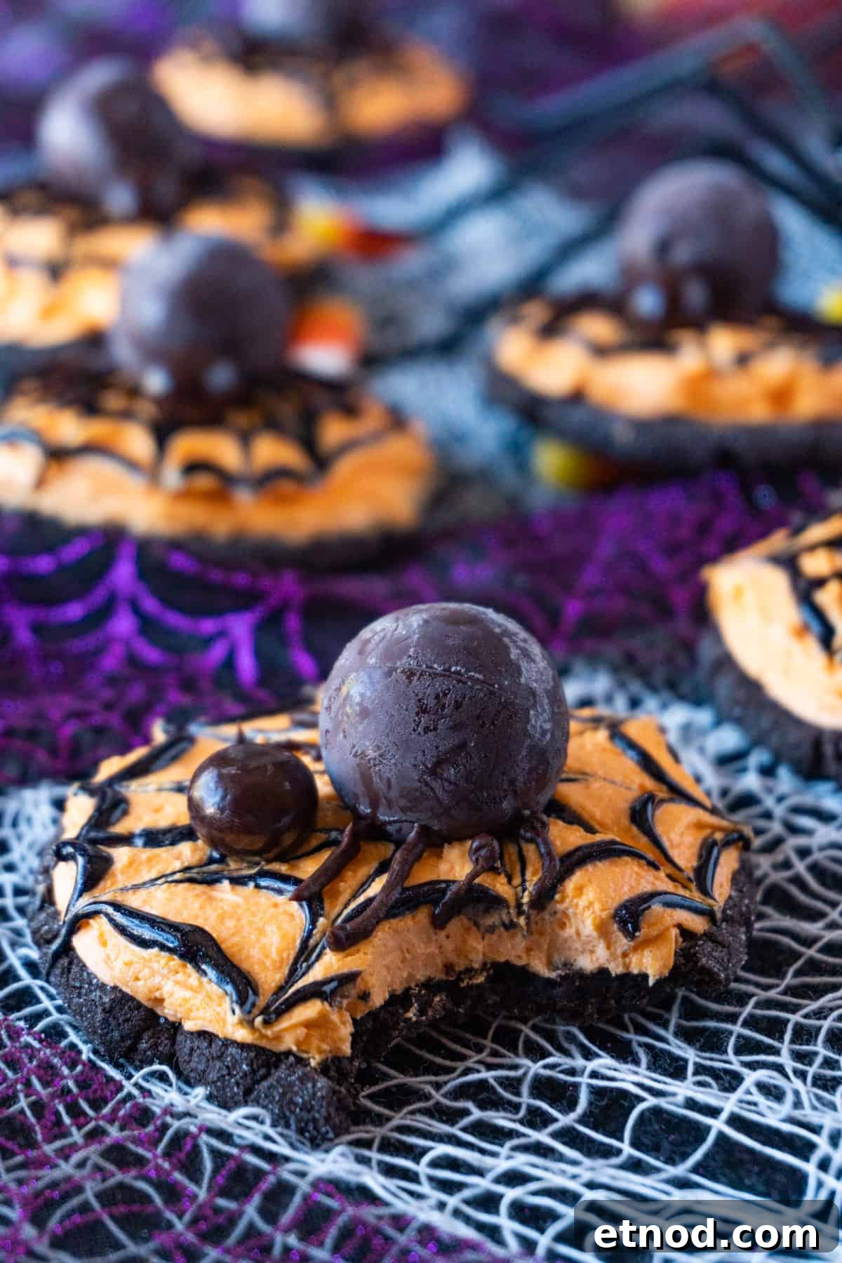Halloween Spider Cookie with a bite taken out.