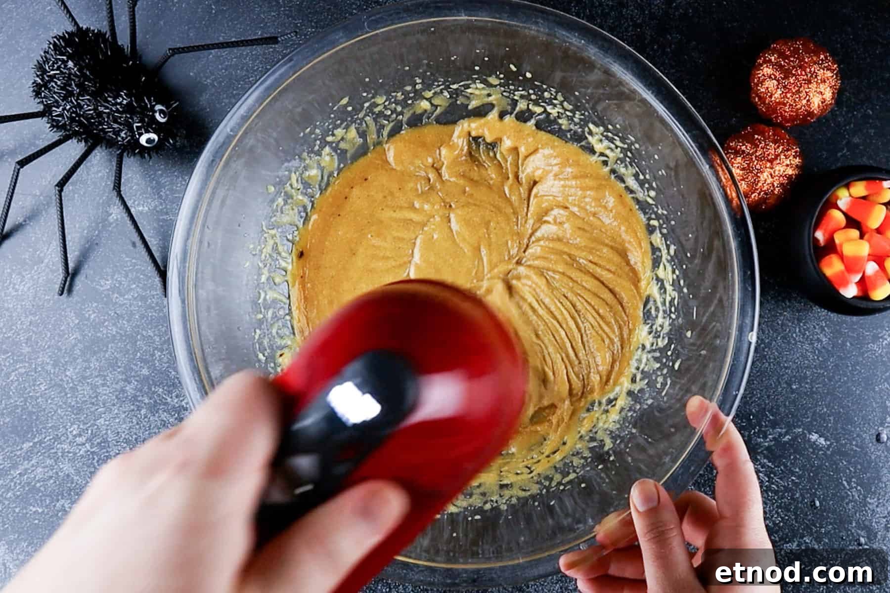 Butter, sugars, and eggs were whisked together in a glass bowl.