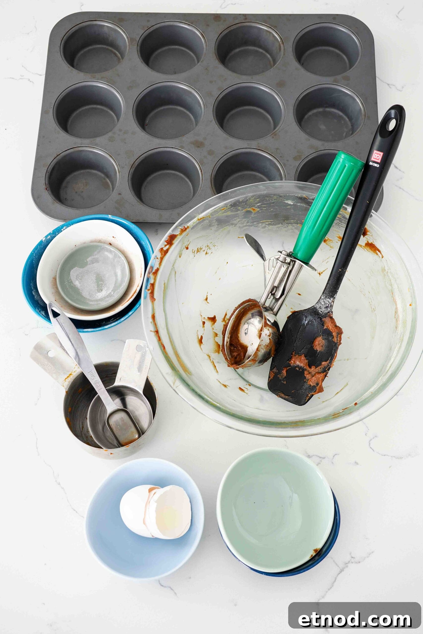 Chocolate Pumpkin Muffins with Melty Chips — Fall Baking Recipe 13 All the dishes used to make chocolate pumpkin muffins on a quartz counter.