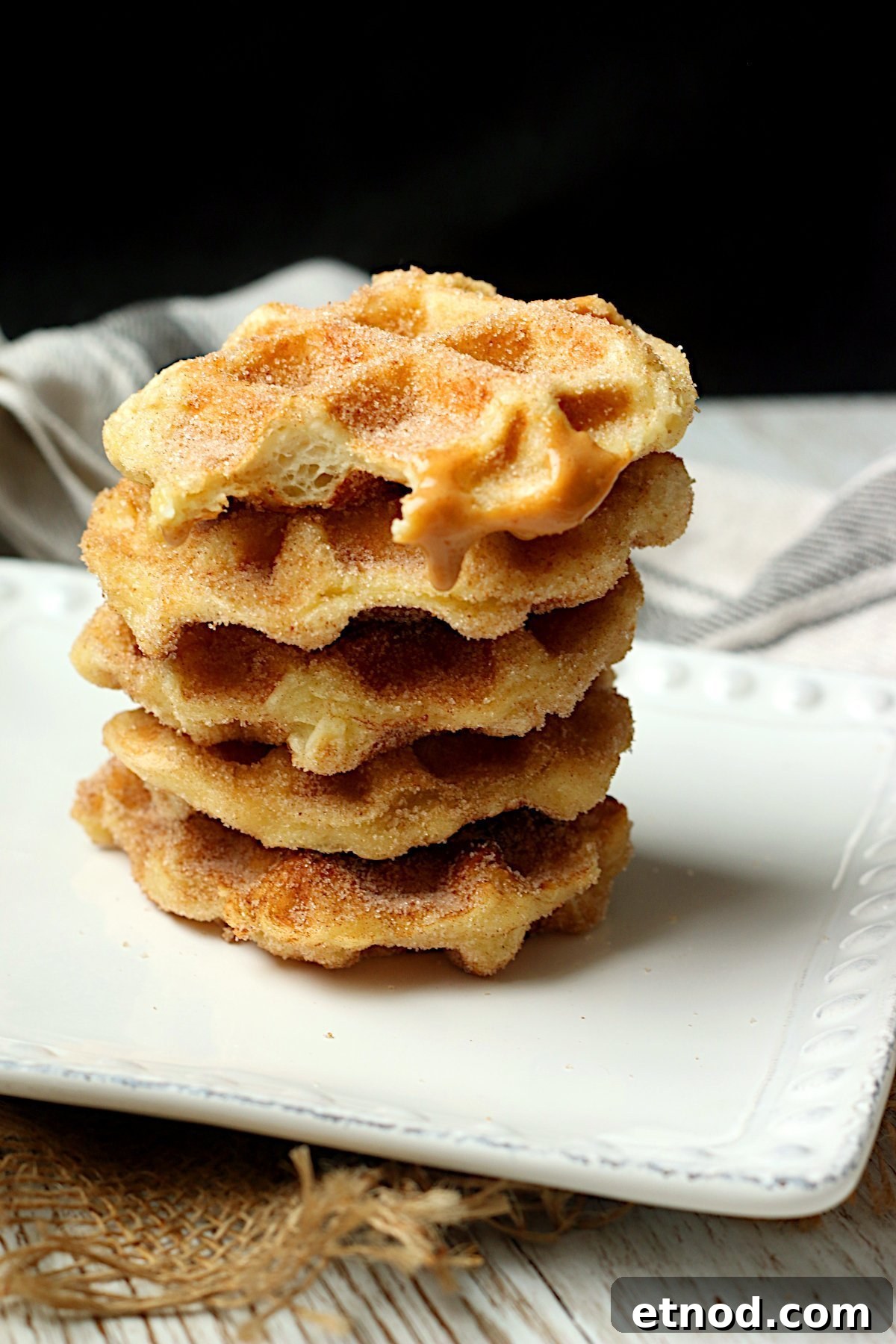 A stack of homemade churro waffles.