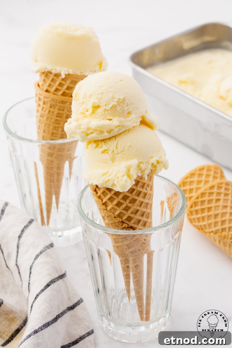Creamy Mascarpone Gelato Recipe: Rich, No-Churn Dessert 6 Two juice glasses holding up ice cream cones topped with homemade mascarpone ice cream.