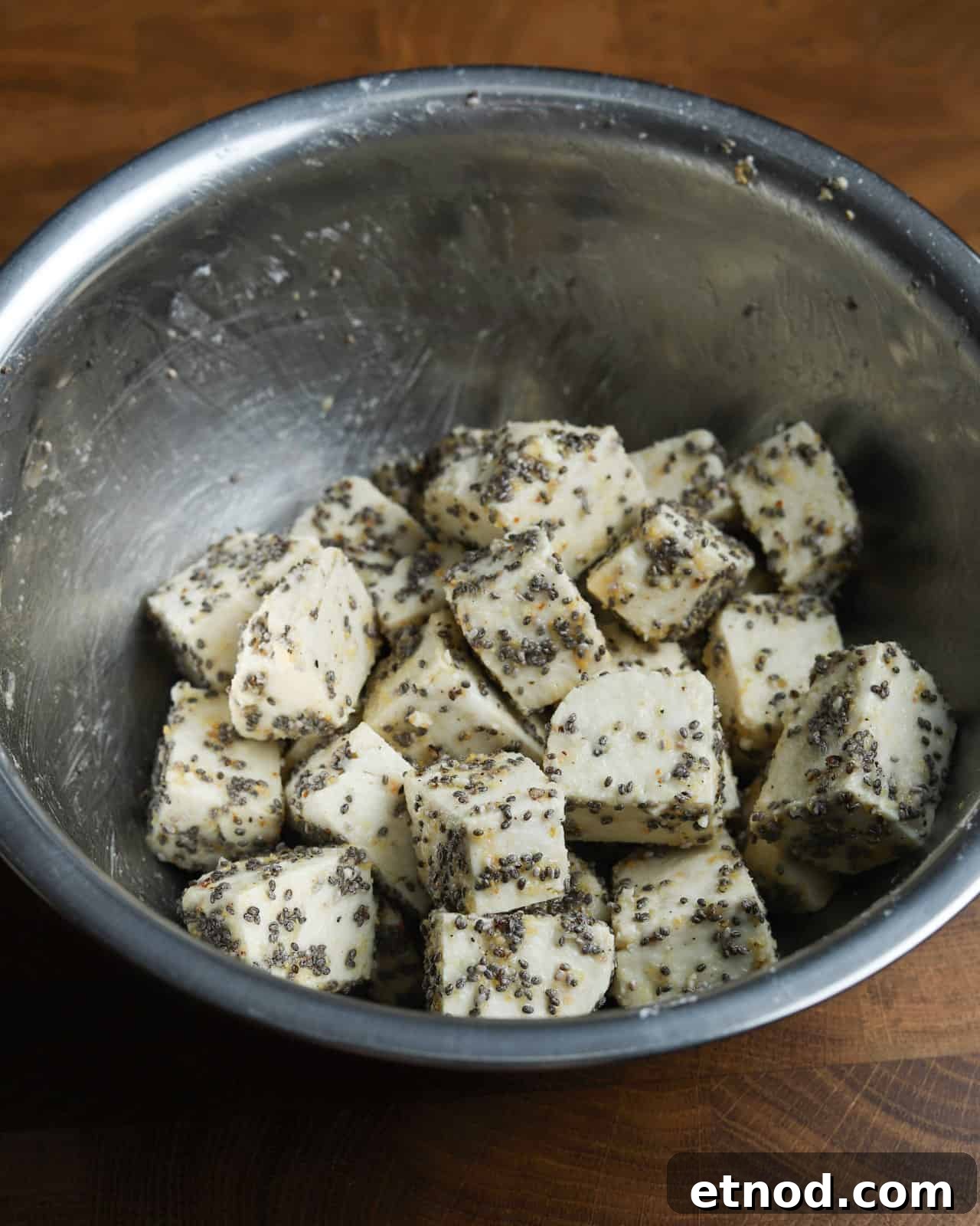 Crispy Air Fryer Tofu Coated with Chia Seeds for Extra Crunch 6 image showing a metal bowl with the crispy chia tofu ingredients mixed together waiting to be cooked.