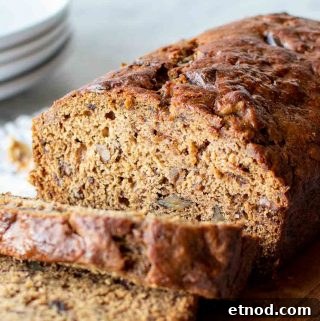 Moist Date and Walnut Bread Recipe for Homemade Comfort 6 date bread on wooden board with slices cut