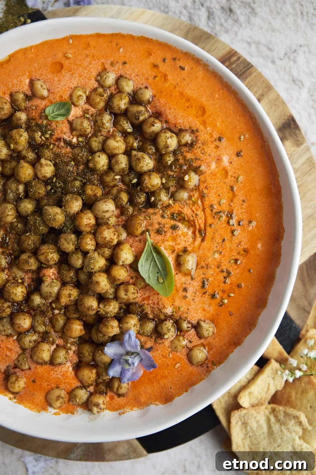 Roasted Red Pepper and Feta Dip with Crispy Chickpeas 3 a white bowl of Roasted Red Pepper Feta Dip with Crispy Chickpeas on top