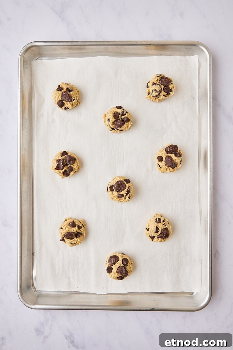 Brown Butter Chocolate Chip Cookies with Extra Chewiness 12 Chocolate chip cookie dough balls scooped onto parchment-lined baking sheet