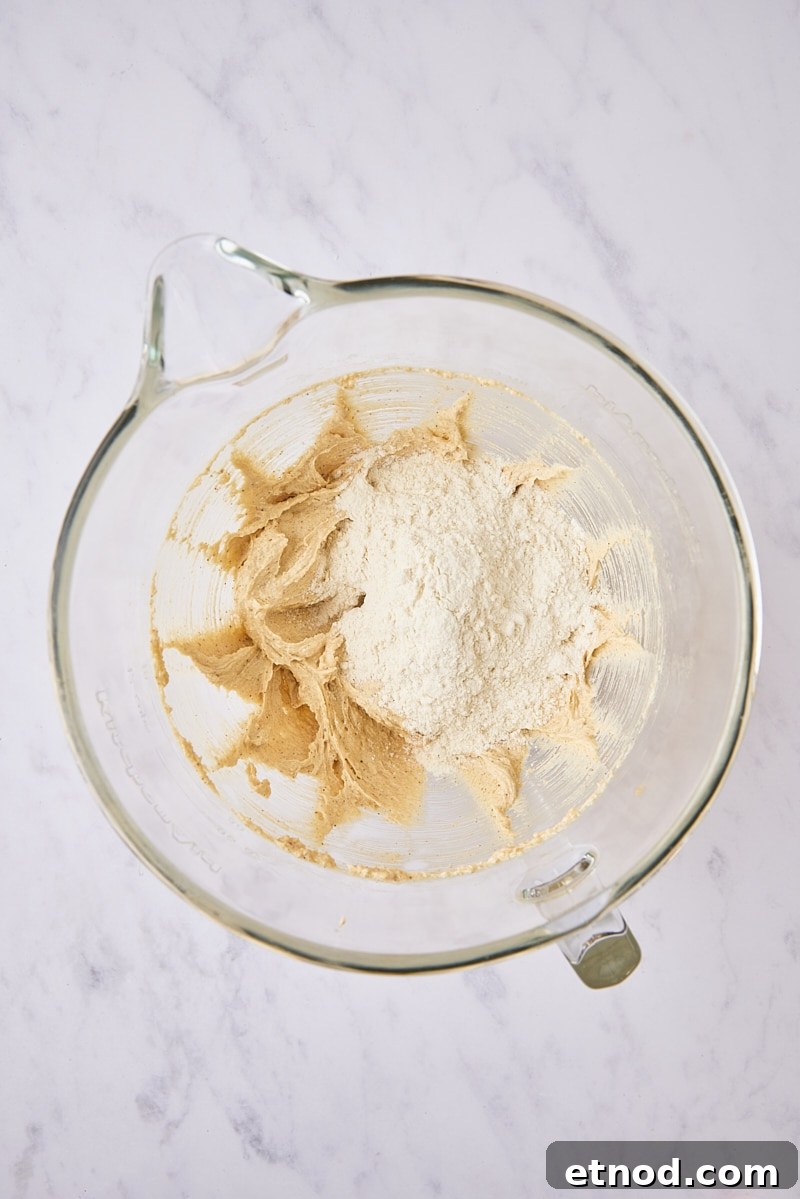 Brown Butter Chocolate Chip Cookies with Extra Chewiness 9 Dry ingredients added to cookie dough in glass mixer bowl