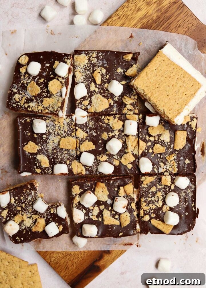Gooey S'mores Bark Recipe for Dessert Lovers 2 s'mores bark sliced into squares on cutting board showing bottom and top layers