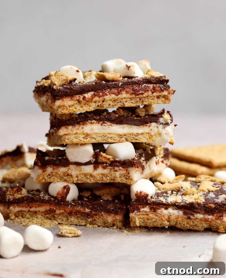 Gooey S'mores Bark Recipe for Dessert Lovers 11 stack of s'mores bark squares on cutting board