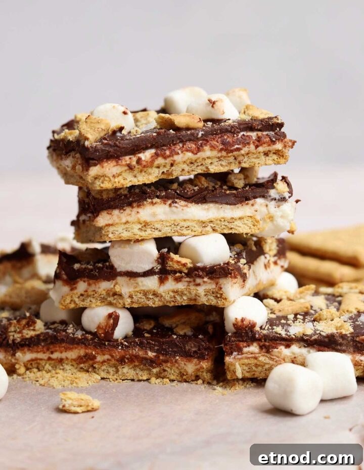 Gooey S'mores Bark Recipe for Dessert Lovers 6 stack of s'mores bark squares on cutting board