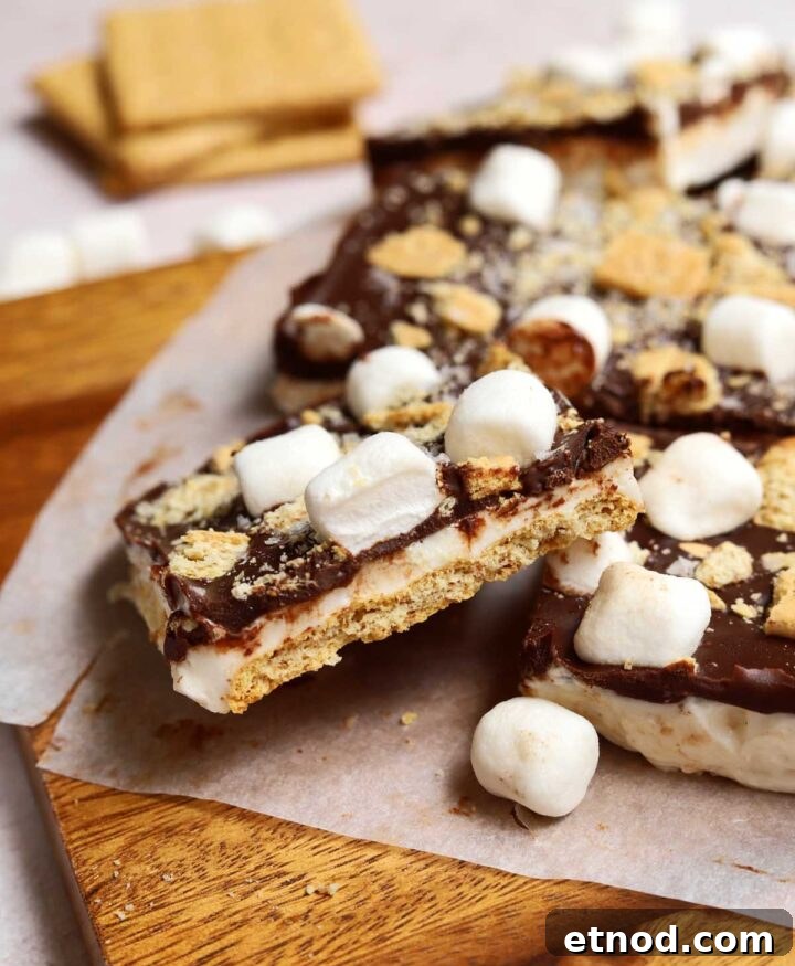 Gooey S'mores Bark Recipe for Dessert Lovers 9 slice of s'mores bark on cutting board showing cross section