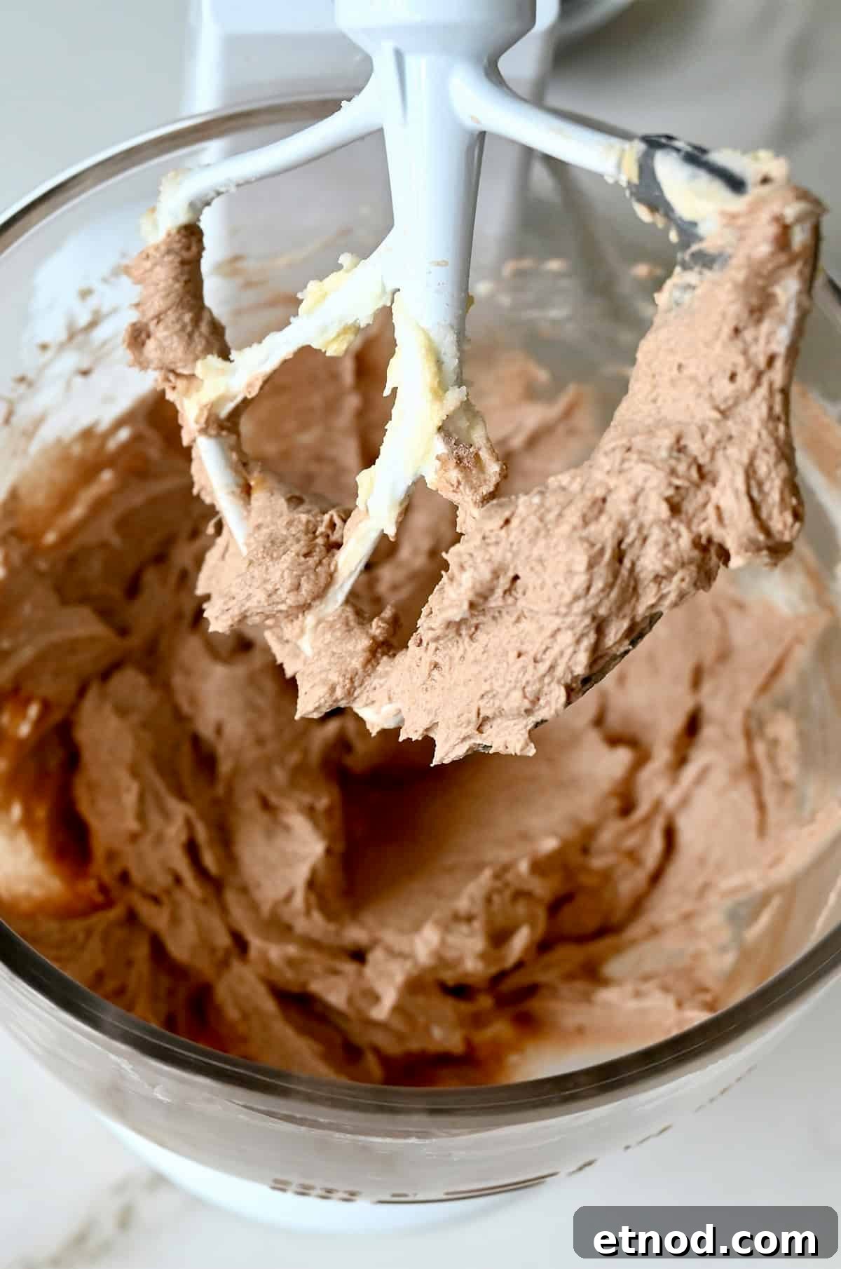 Decadent Chocolate Loaf Cake Recipe for Moist, Rich Results 6 Chocolate loaf cake batter in the bowl of a stand mixer with the paddle attachment.