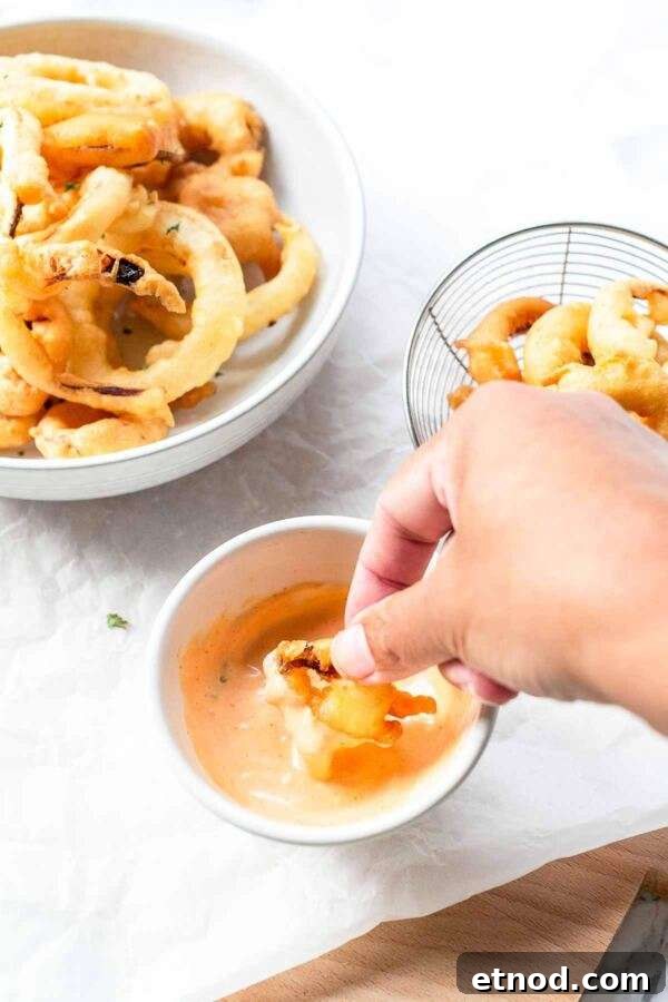 Homemade onion rings made with a simple batter and are deep fried. Great to serve as a side dish or a snack.