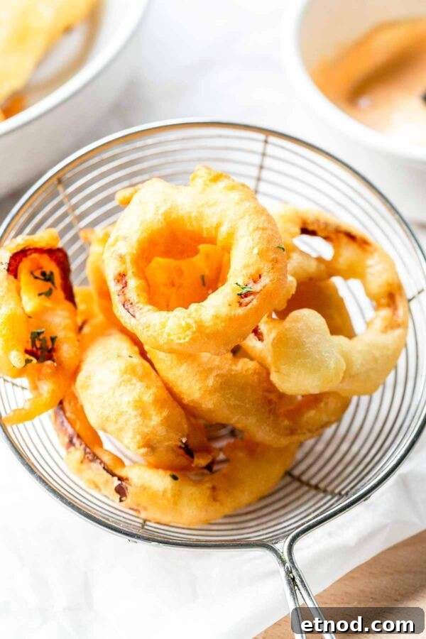 Super easy homemade crispy onion rings. They are made with a simple batter and are deep fried.
