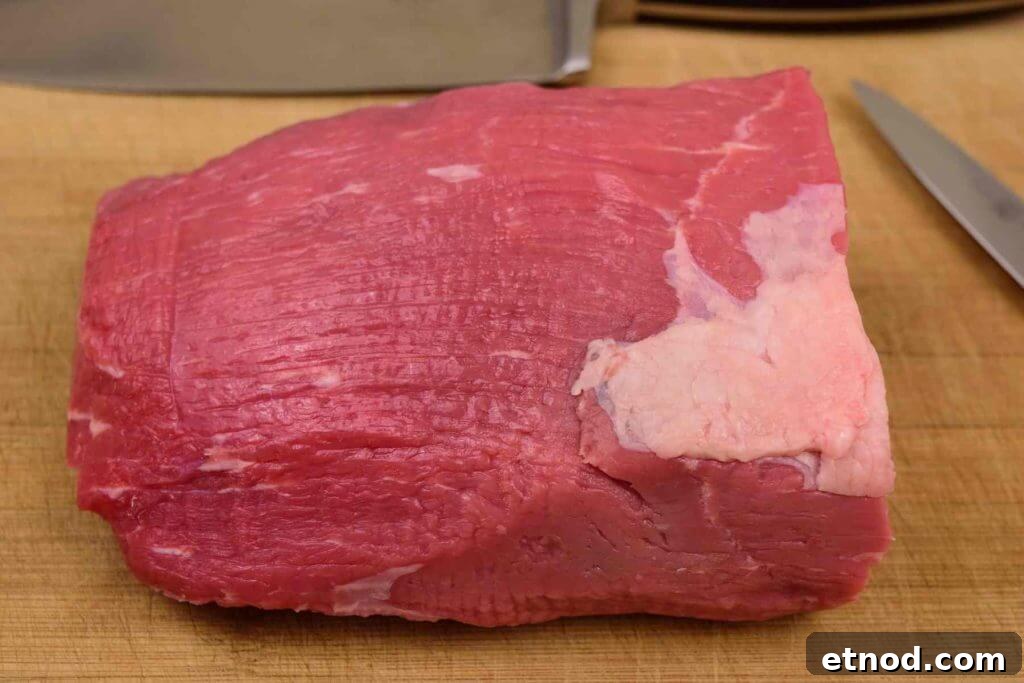 Cherry Bomb Beef Jerky: Spicy-Sweet Gourmet Snack 3 Eye of Round Roast on cutting board