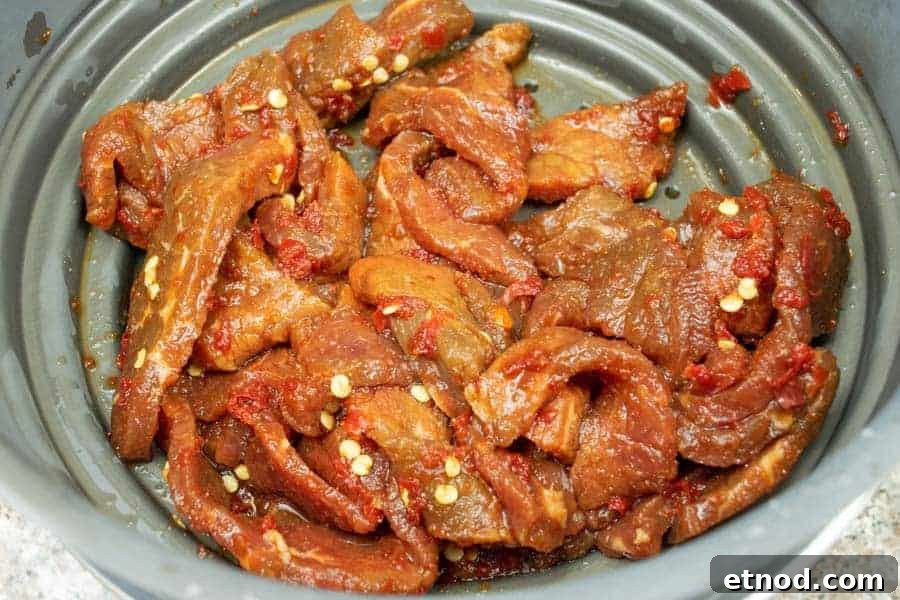 Cherry Bomb Beef Jerky: Spicy-Sweet Gourmet Snack 10 beef jerky strained in colander