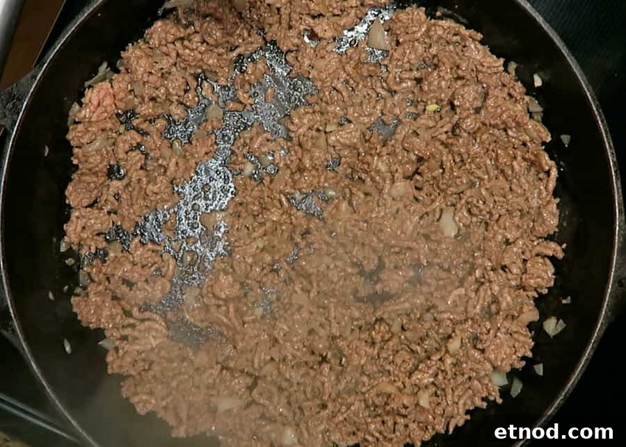 30-Minute Korean Ground Beef Stir-Fry (One-Pot Recipe) 6 ground beef being browned in large cast iron skillet