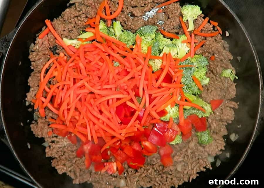 30-Minute Korean Ground Beef Stir-Fry (One-Pot Recipe) 7 veggies being added to the skillet