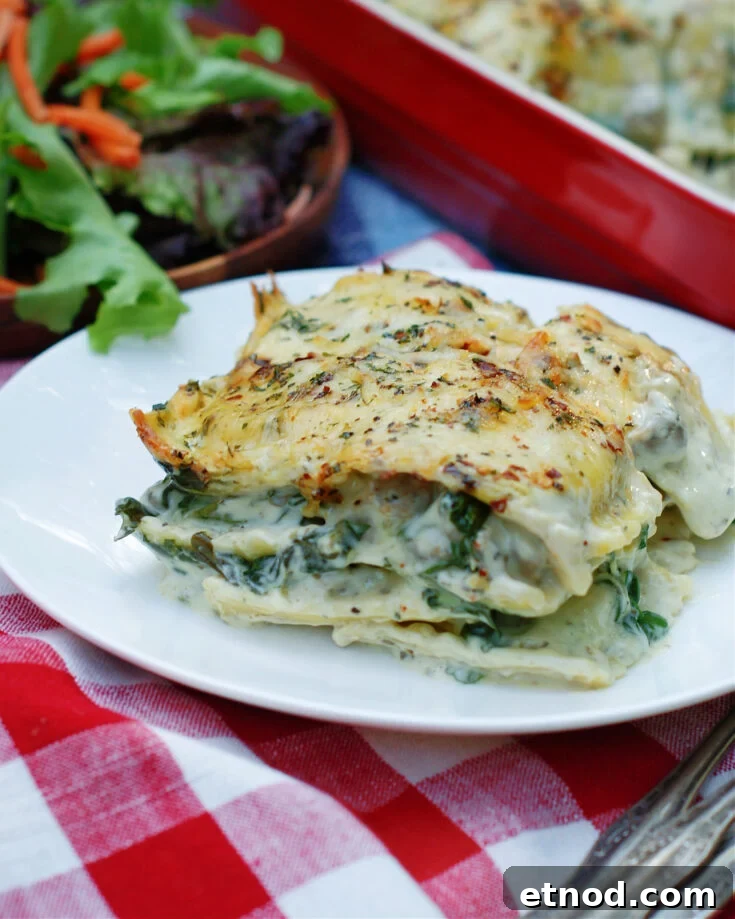close up of a slice of white ravioli casserole to show ingredients and texture
