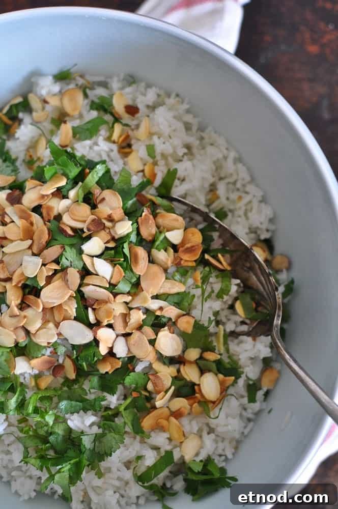 This coconut-cilantro rice is an easy and delicious gluten-free side dish made with coconut milk and topped with fresh cilantro and toasted almonds. Coconut Cilantro Rice
