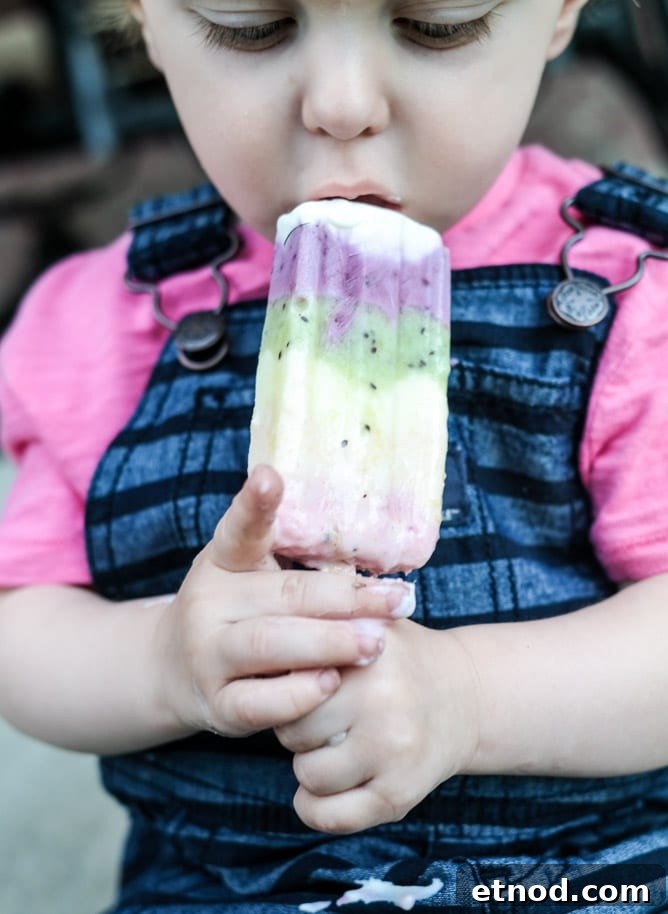 Rainbow Fruity Frozen Yogurt Popsicles: Refreshing Summer Treat 11 rainbow froyo pops I howsweeteats.com