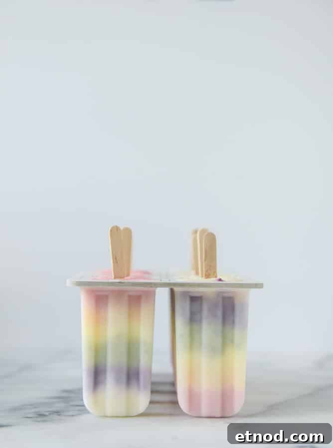 Rainbow Fruity Frozen Yogurt Popsicles: Refreshing Summer Treat 5 rainbow froyo pops I howsweeteats.com